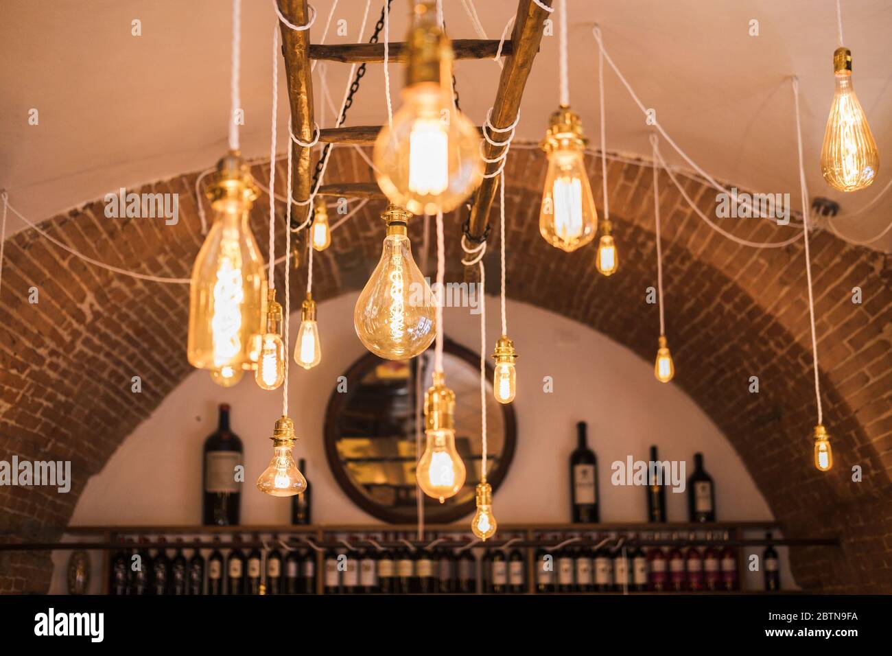 Light bulbs on the ceiling in the bar and restaurant. Italian cafe with