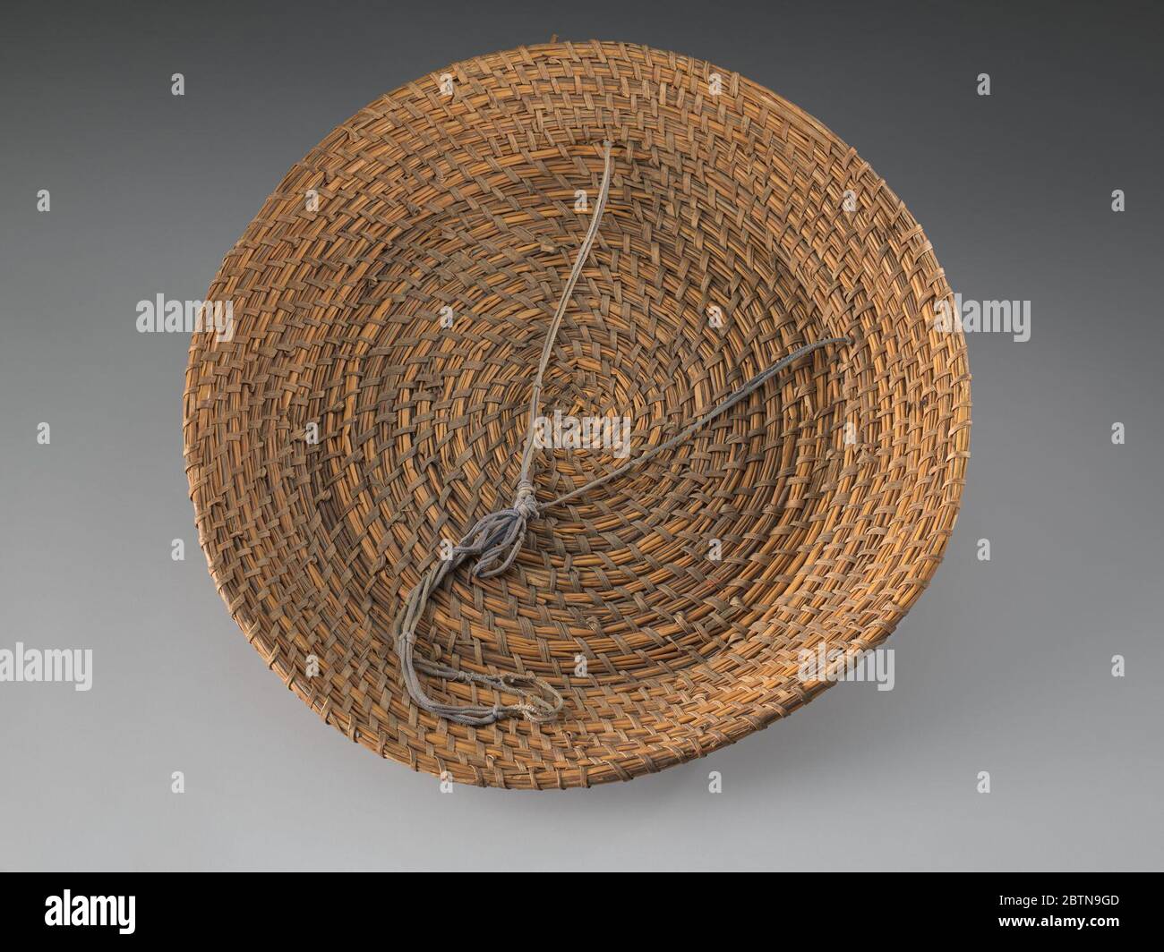 Rice fanner A rice fanner basket identified as being made by an enslaved person the South Carolina coast. The shallow, round shaped basket is made of reeds, rush