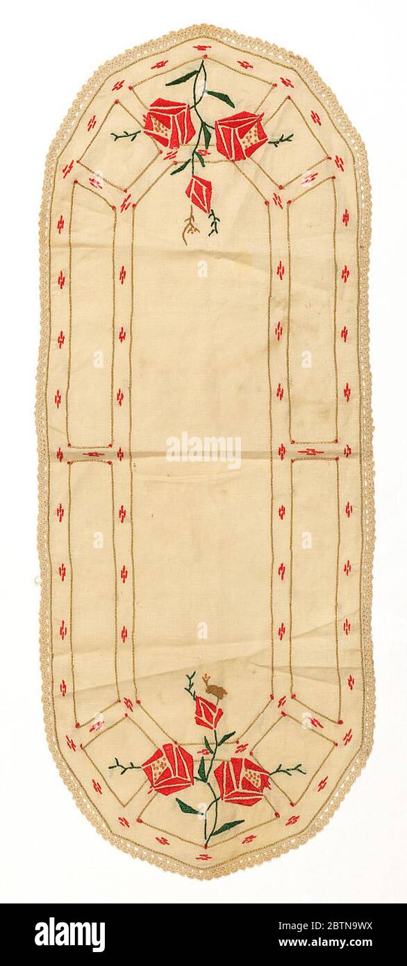 Runner. Off-white oval table runner has a double border outlined in tan  stem stitches that contains small groups of red stitchwork. A cluster of  conventionalized red roses embellishes both ends Stock Photo -