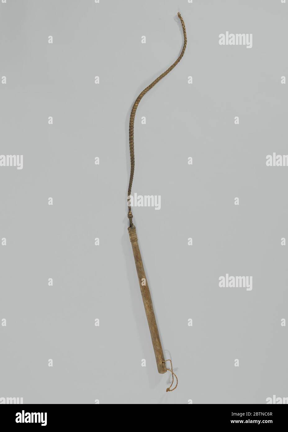 Slave whip owned by British abolitionist Charles James Fox. Braided hide whip with wooden handle. A small ring of hide has been put through a hole at the end of the handle, presumably for storing the whip by hanging. Stock Photo