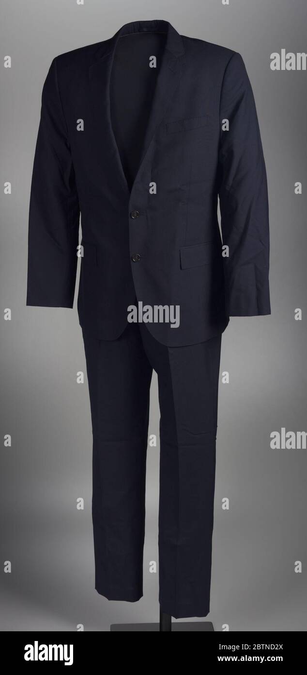 Suit worn by Dr Jamal Harrison Bryant to a protest in Ferguson Missouri. This suit consists of a jacket (.1) and pants (.2) worn by Dr. Jamal Harrison Bryant to a protest in Ferguson, Missouri. The jacket (.1) is a black wool single-breasted blazer with a notched lapel and full-length straight sleeves. Stock Photo