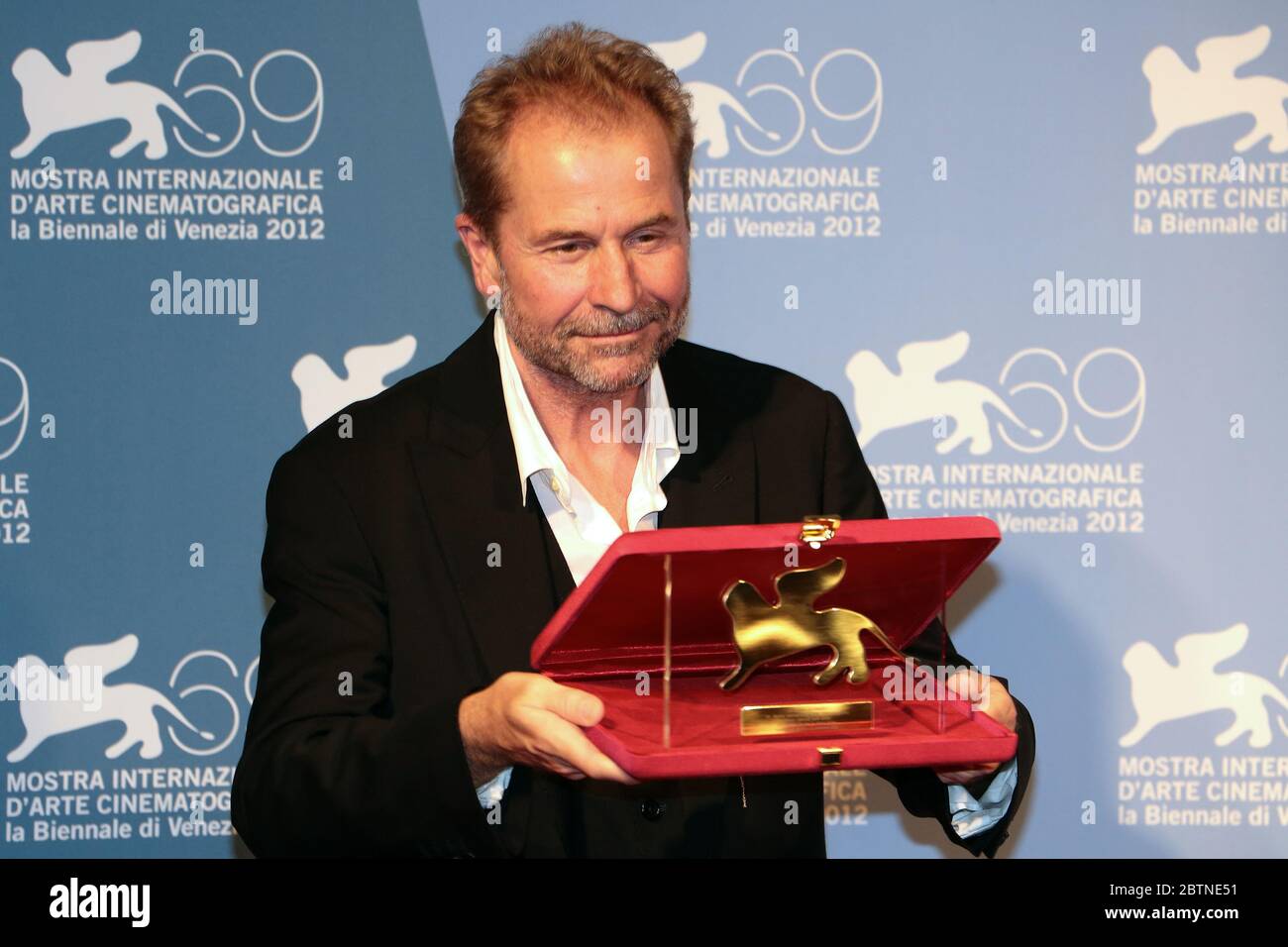 VENICE, ITALY - SEPTEMBER 08: Ulrich Seidl holds the Special Jury Prize for 'Paradies' at the Award Winners Photocall Stock Photo