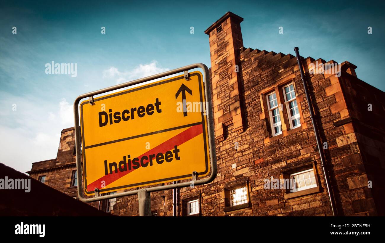 Street Sign the Direction Way to Discreet versus Indiscreet Stock Photo ...