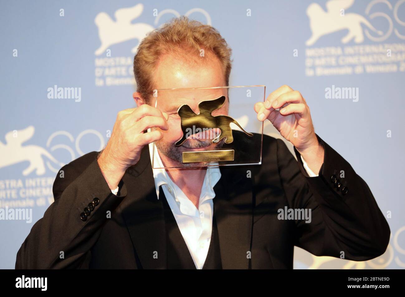 VENICE, ITALY - SEPTEMBER 08: Ulrich Seidl holds the Special Jury Prize for 'Paradies' at the Award Winners Photocall Stock Photo