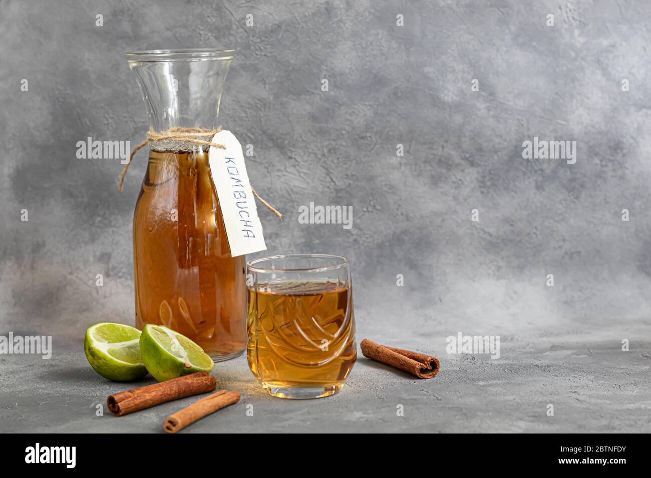 Kombucha or cider, fermented drink on a gray background. A probiotic