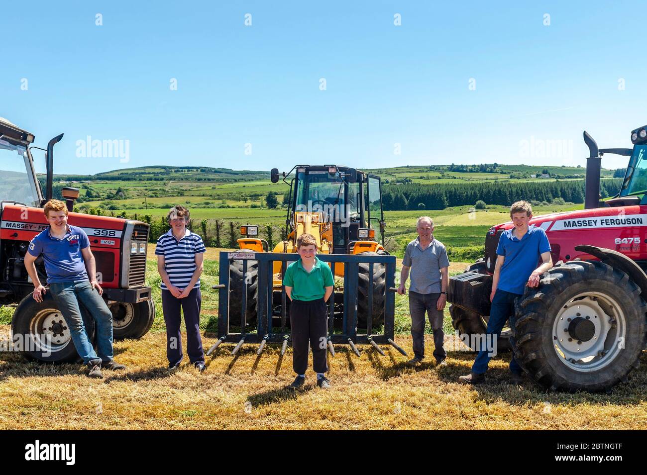 Drinagh, West Cork, Ireland. 27th May, 2020. On a very sunny day in West Cork, the Wilson family draw silage on their farm in Drinagh, West Cork. Pictured are Evan, mum Mary, Dannie, dad George and Jamie. Credit: AG News/Alamy Live News Stock Photo