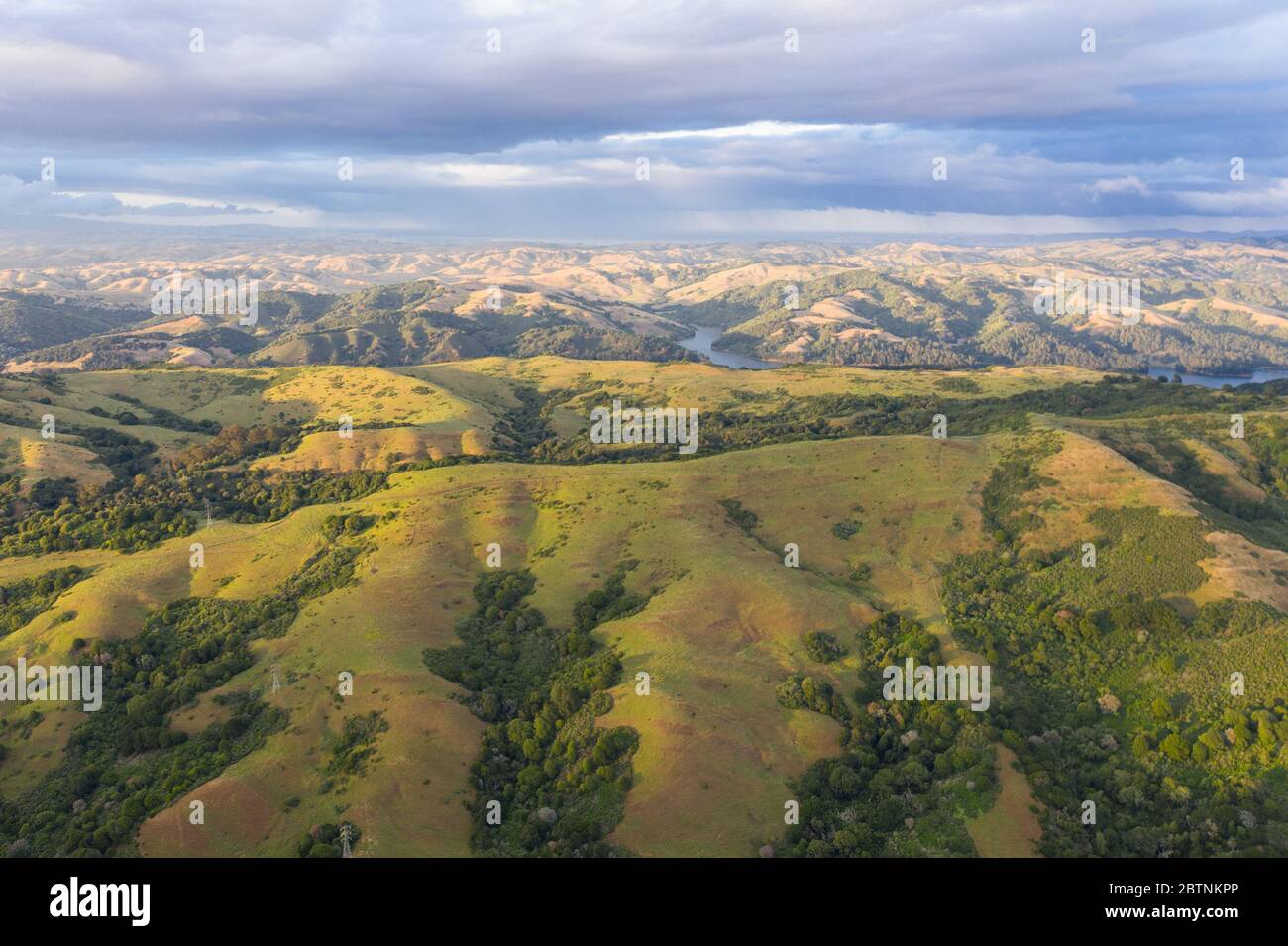 Late afternoon sunlight illuminates the beautiful, rural hills and valleys of the East Bay, just east of San Francisco Bay in Northern California. Stock Photo