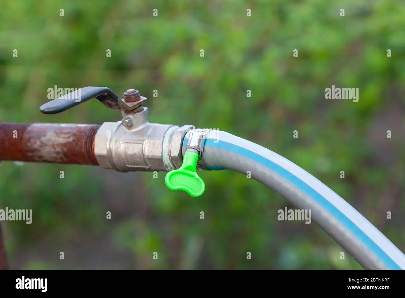 Garden hose attached to tap hires stock photography and images Alamy