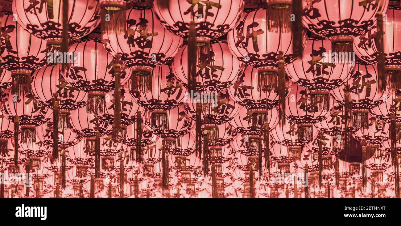 Chinese red lanterns hanging in street at night for decoration. Chinese ...