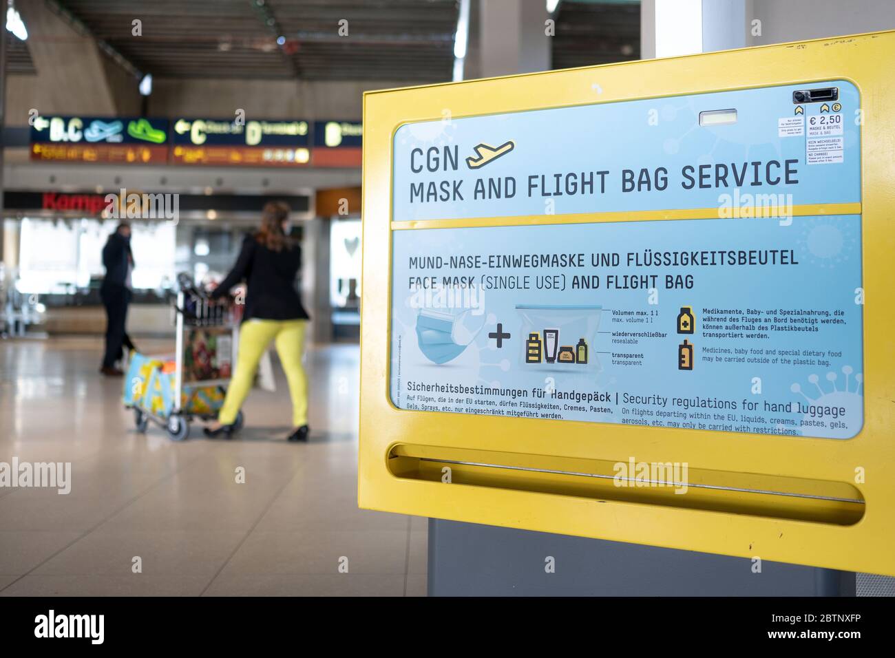 Cologne, Germany. 27th May, 2020. A vending machine for mouth-nose masks  and fluid bags hangs in the terminal of Cologne/Bonn Airport. Cologne/Bonn  Airport and the airline Eurowings provided information on extended health