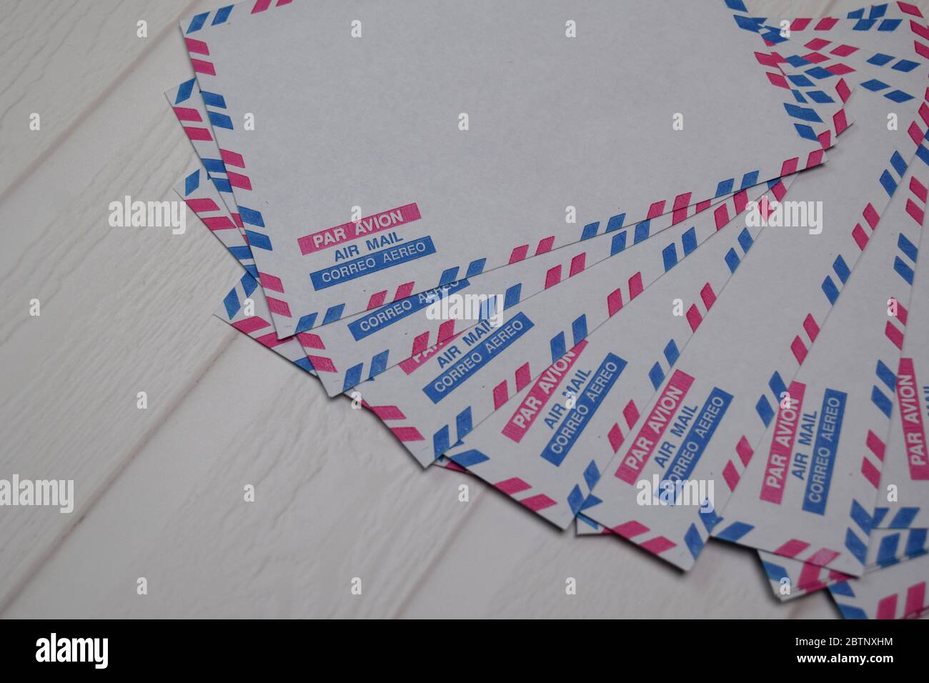 Air Mail Envelope isolated on wooden table. Stock Photo