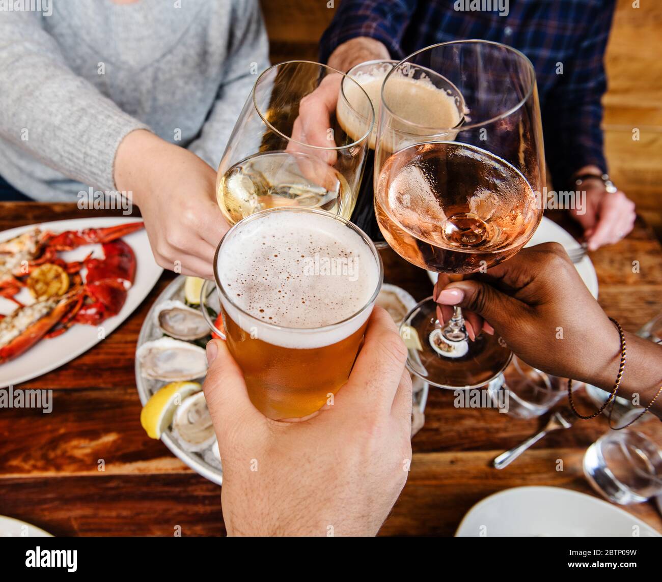group of friends drinking at a restaraunt Stock Photo