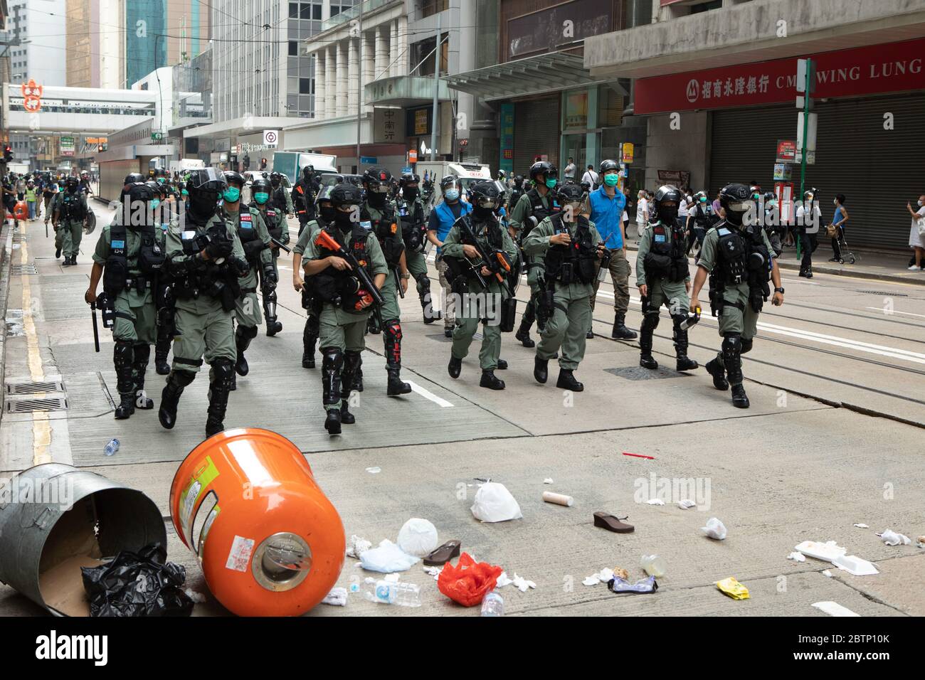 Hong Kong Hong Kong, S.A.R. China - 27 May, 2020 Pictured, Hong Kong Police Force Riot Squads patrol the central finance and business district of Hong Kong as tensions have flared in the the City since the National Anthem Law was announced and during the  Reading of the National Anthem Bill Credit: Simon Jankowski/Alamy Live News Stock Photo