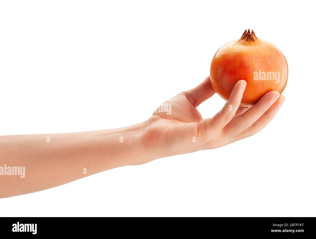 yellow seedless pomegranate in hand path isolated on white Stock Photo