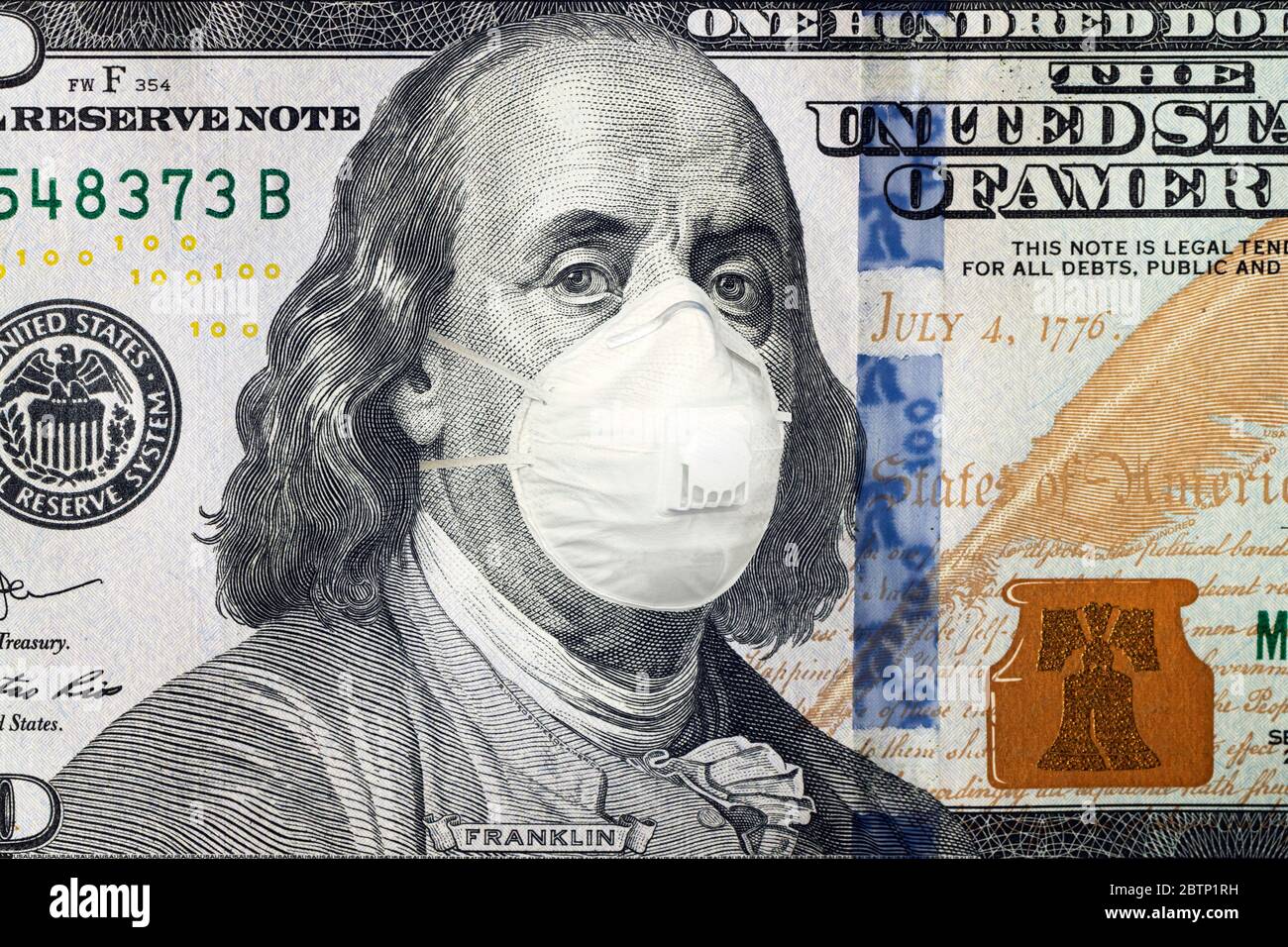 COVID-19 coronavirus in USA, 100 dollar money bill with N95 Face Mask. Coronavirus affects global stock market. World economy hit by corona virus outb Stock Photo