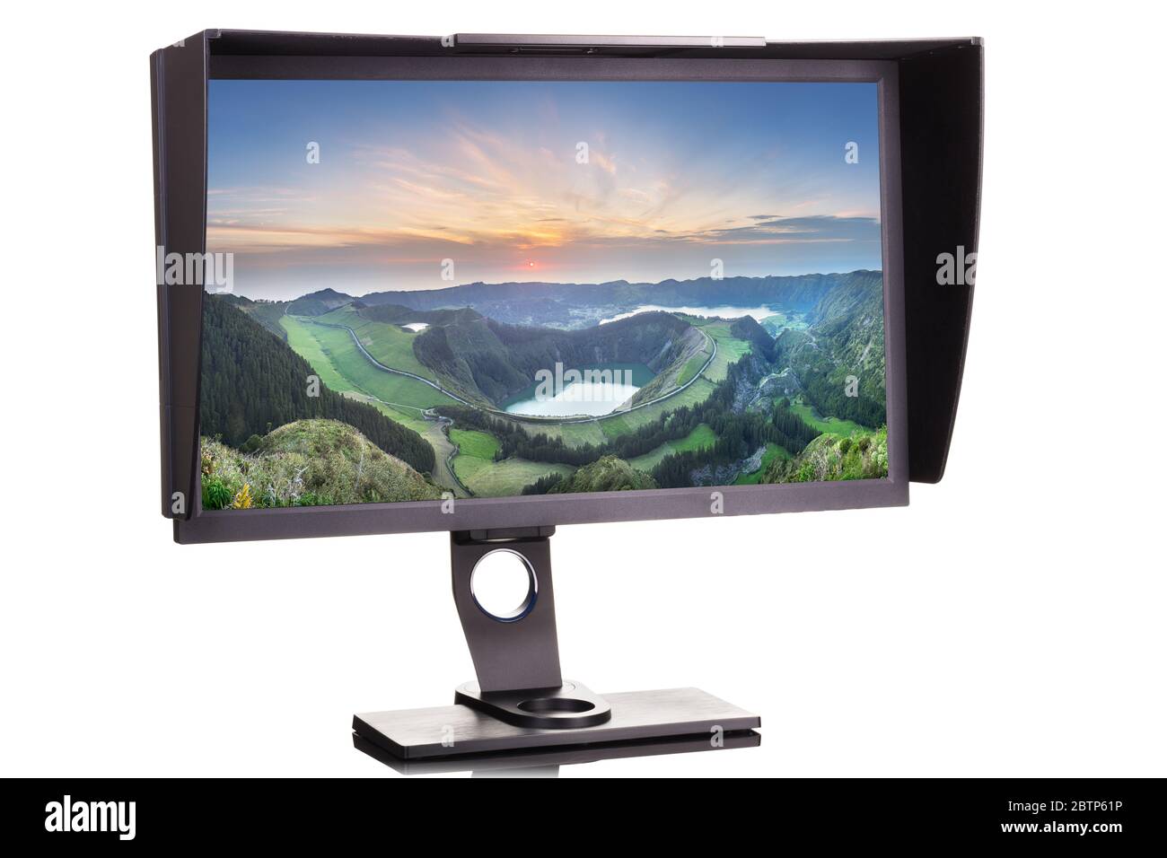 Professional photographer monitor with shading hood isolated on white