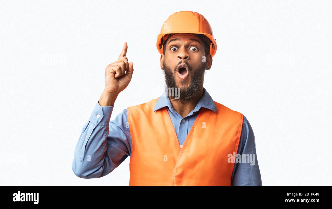 Builder Pointing Finger Up Having Great Idea On White Background Stock Photo