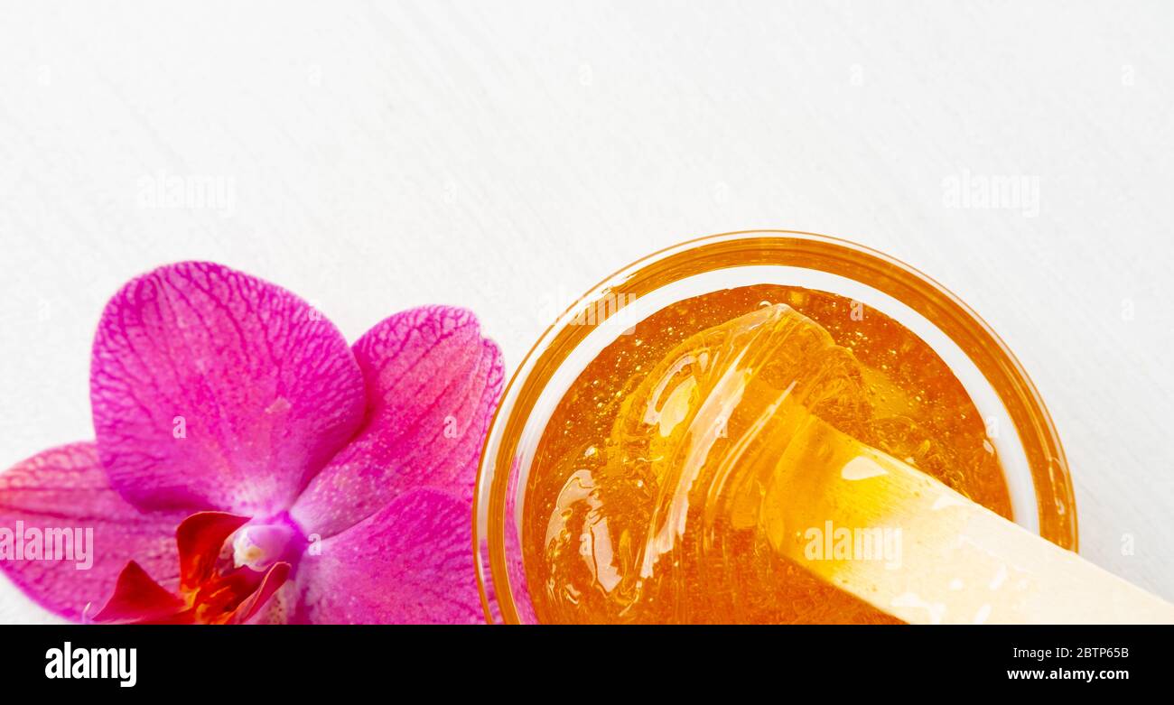 sugar paste or wax honey for hair removing with wooden waxing spatula