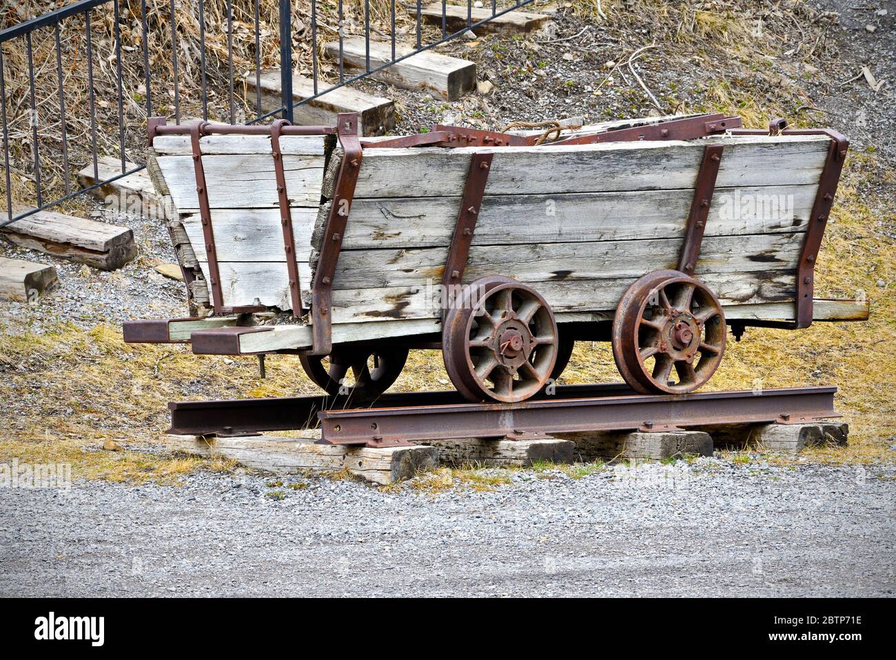 A mining cart from the early 1900's riding on rails built to remove ore from the coal mine shaft in Cadomin Alberta Canada Stock Photo