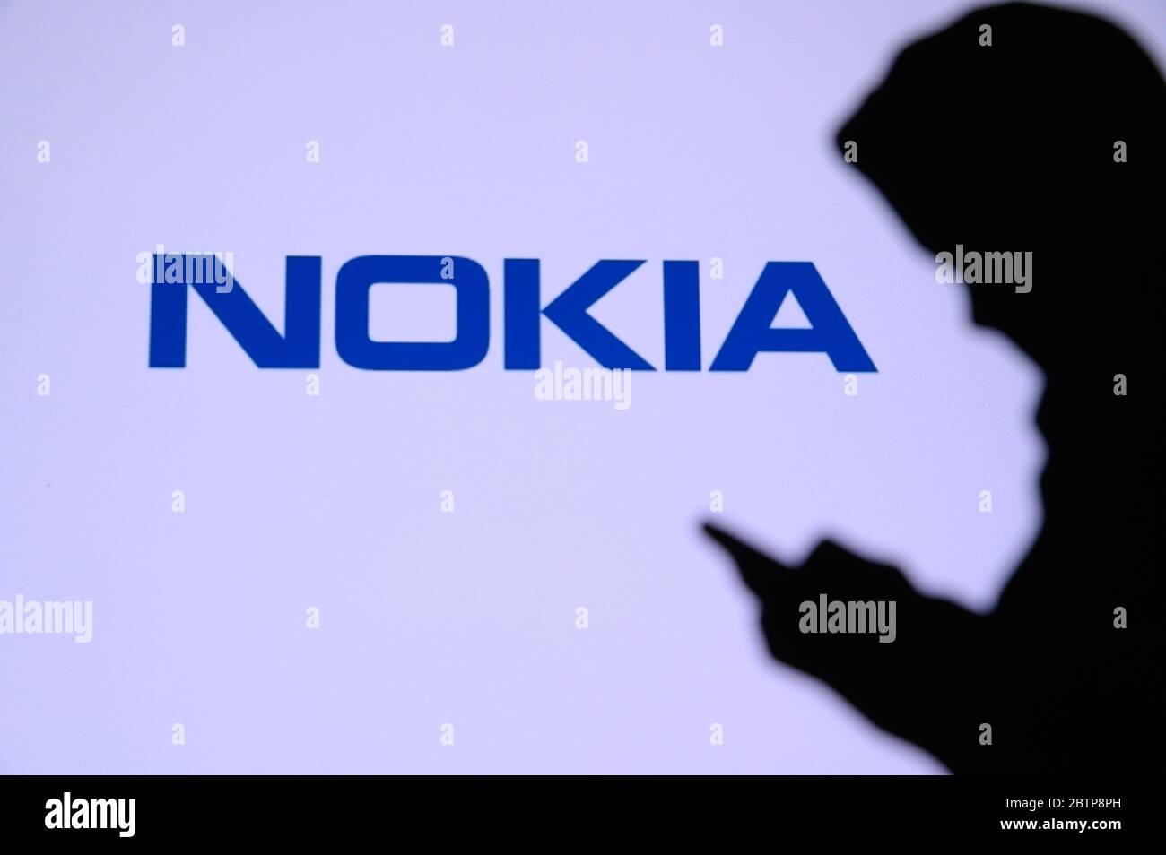 NEW YORK, USA, 25. MAY 2020: Nokia a Finnish telecommunications, technology, and electronics company Young boy chat on mobile phone. Company logo on s Stock Photo