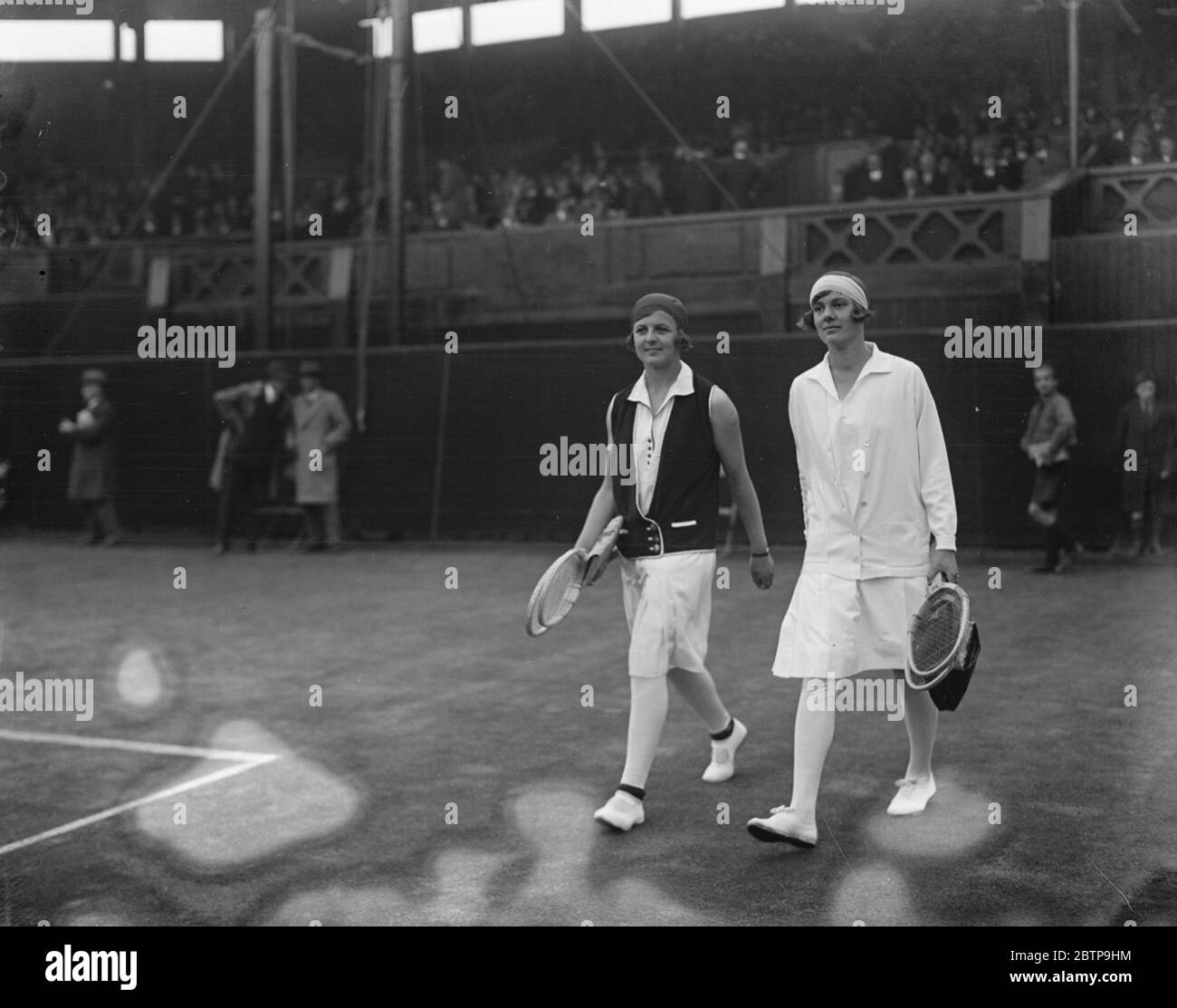 Lawn tennis at Wimbledon . Miss Nuthall and Miss Joan Fry coming out for their match . 28 June 1927 Stock Photo