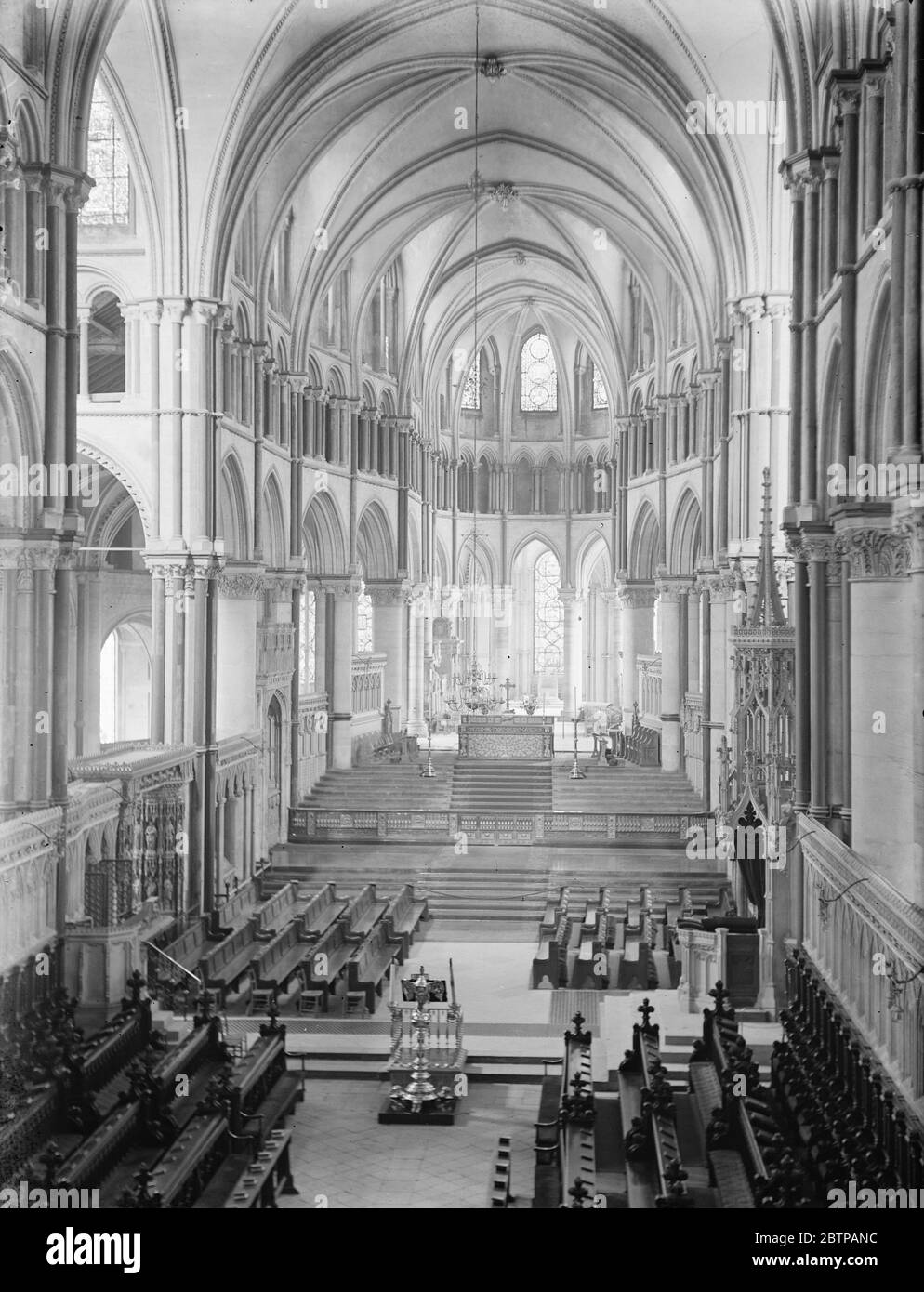 Canterbury Cathedral . Interior , looking towards the Chapel of St Thomas a Becket , and showing the Choir and High Altar . The Archipiscopal Throne is seen on right . 13 November 1928 Stock Photo