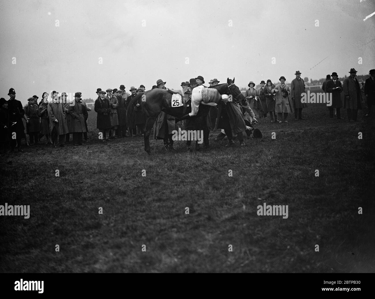 Sensational Grand National. One of the most sensational Grand National 's in history sends in a victory at Aintree for the hundred to one chance, ' Tipperary Tim ' . Tommy Cullinan remounts  Billy Barton  after falling at the last fence . He was the only other horse to finish the race . 30 March 1928 Stock Photo