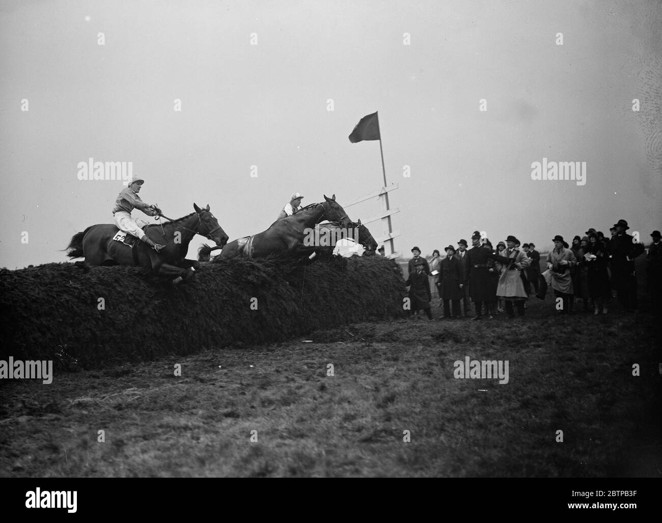 Sensational Grand National . The eventual winner , ' Tipperary Tim ' ( on left ) and  Billy Barton  ( 2nd ) taking last jump with a riderless horse . 30 March 1928 Stock Photo