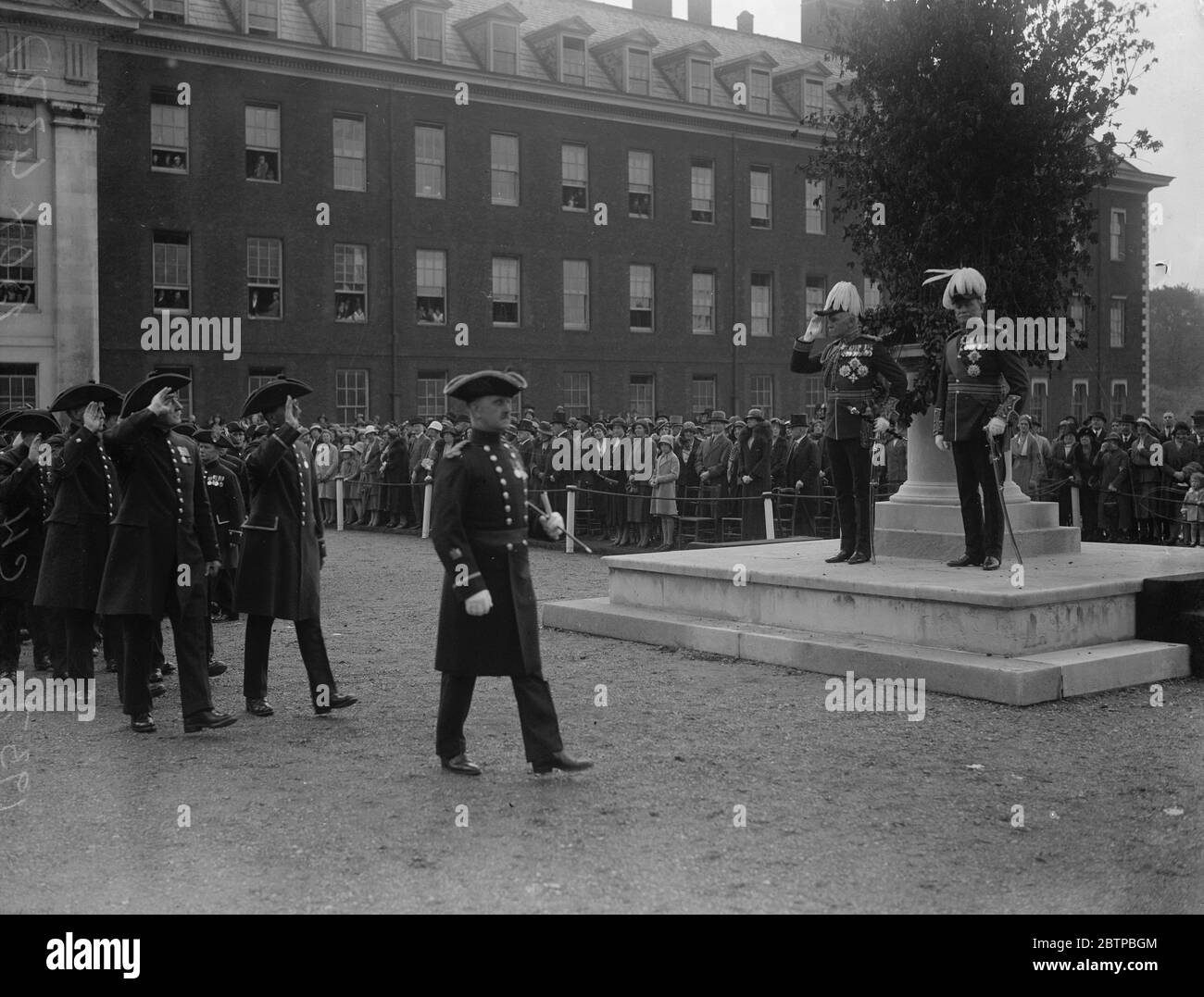 Oak Apple Day celebrations . The pensioners marching past Sir George . Milne and the Governor of the Hospital . 10 May 1932 Stock Photo