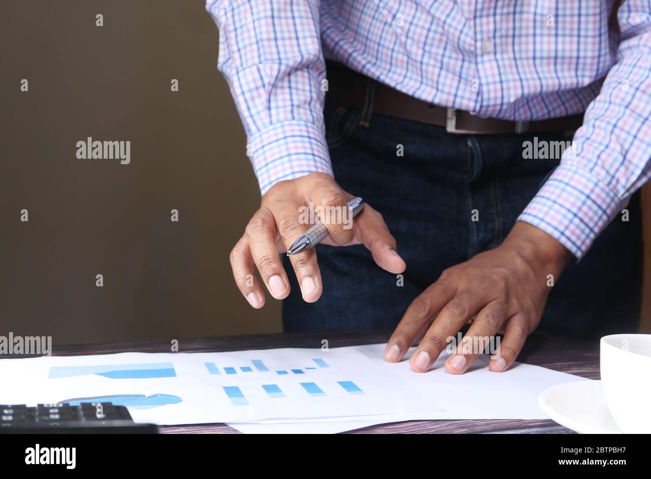 businessman analyzing financial data at office desk  Stock Photo