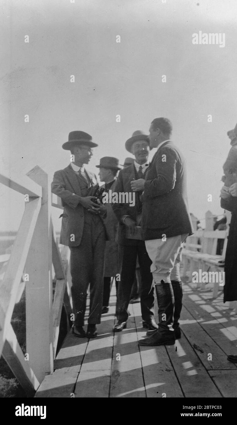 Latest photographs from China . Hsuan Tung , with his English tutor and General Frank Sutton ( tall figure ) late advisor to Marshal Tso Ling , at Tientsin . 30 November 1931 Stock Photo
