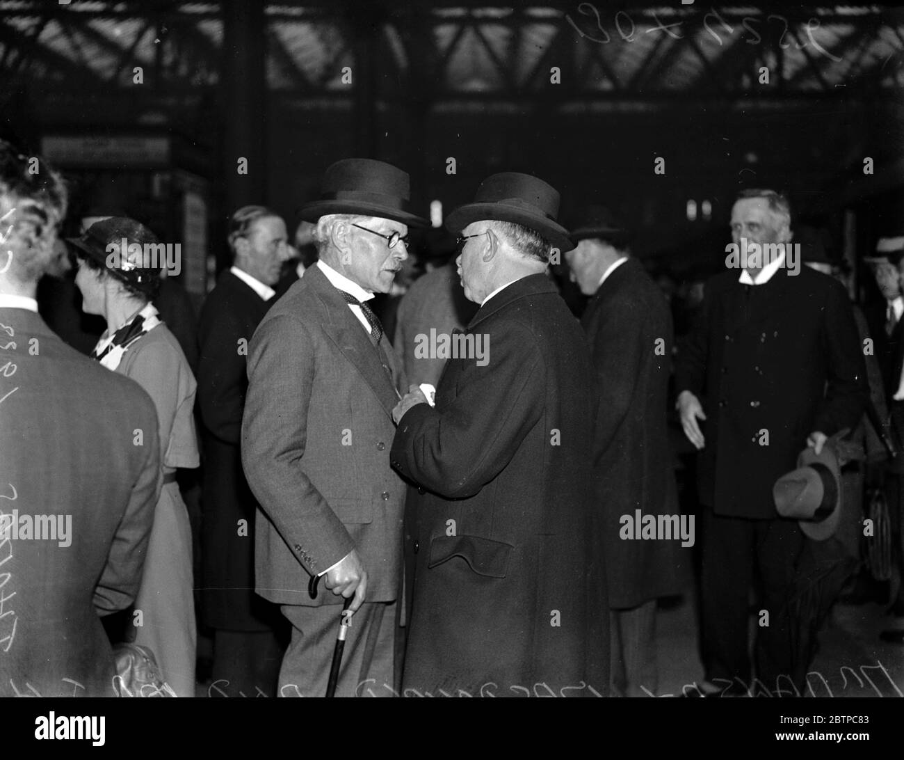 Premier 's homecoming . Mr Ramsay MacDonald reached London on Wednesday . The Premier chatting to Mr J H Thomas , MP . 3 May 1933 Stock Photo