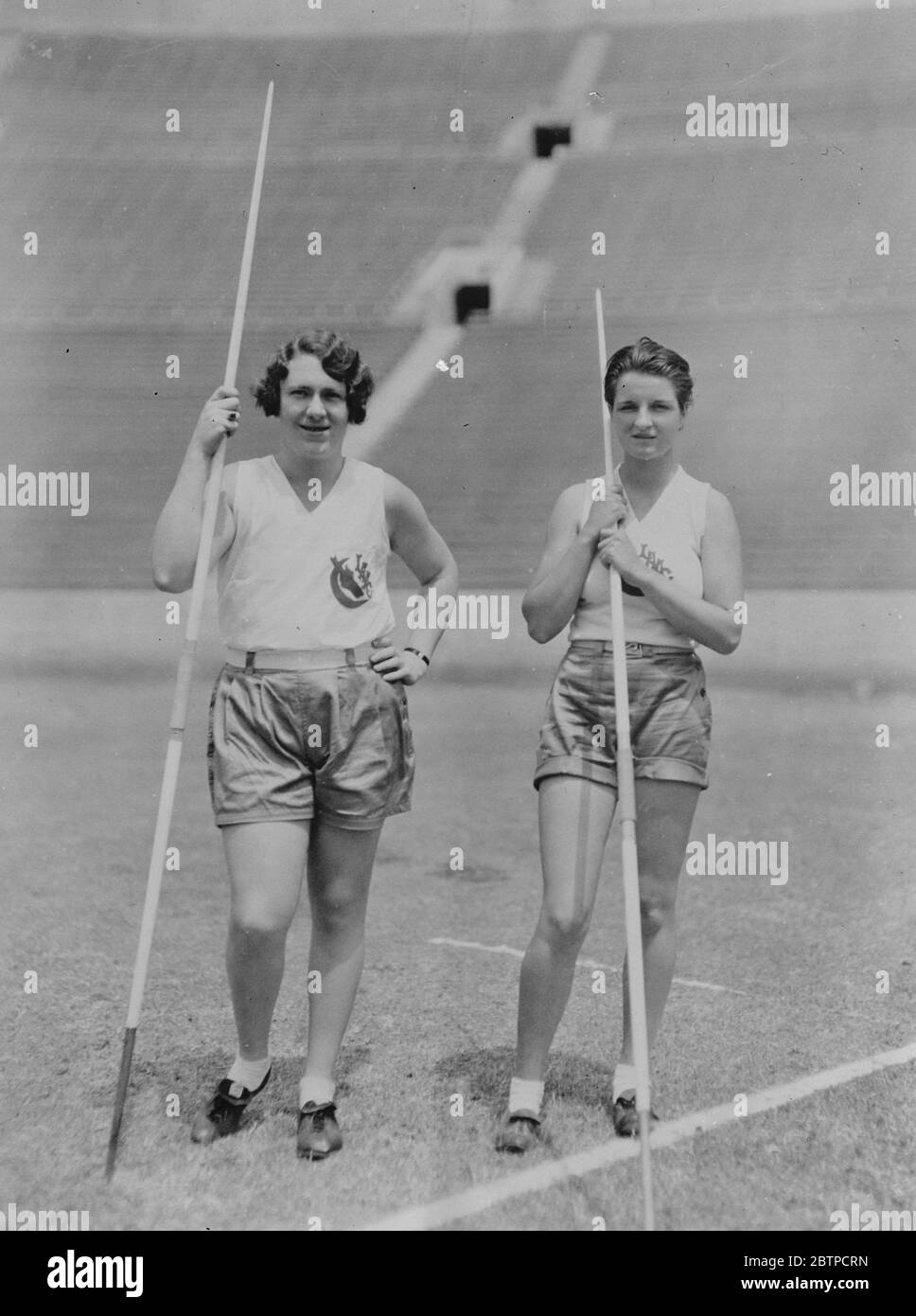 Champions both . Miss Lilian Copeland , the holder of the American record record for women ' s javelin throw and shot , and Miss Alice Rydon , the Southern California Champion javelin and hurdler on the track at Los Angeles stadium where the next Olympic games will be held . 29 September 1931 Stock Photo