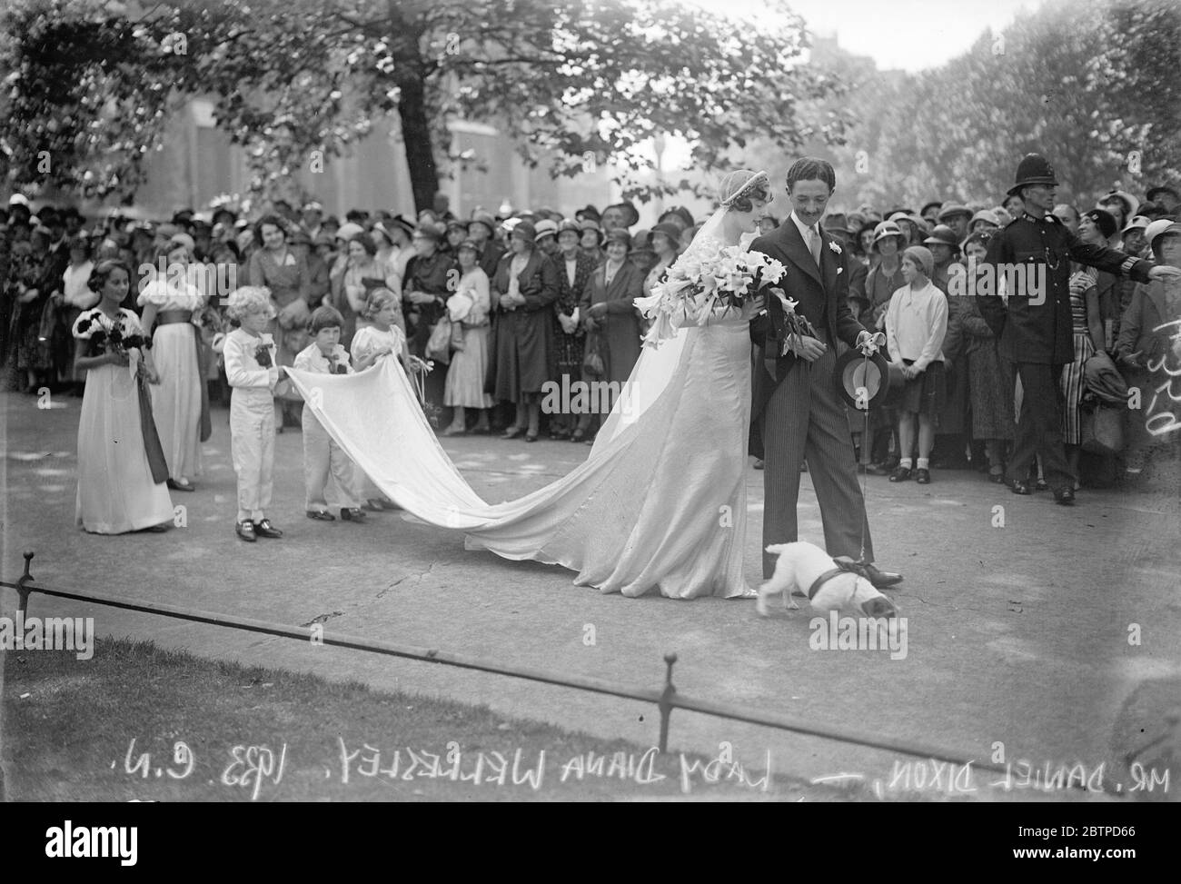 Lady Diana Wellesley married . Lady Diana Wellesley and Mr Daniel Dixon , Grenadier Guards , were married at St Margaret 's , Westminster . The bridal procession after the ceremony . 20 July 1933 Stock Photo