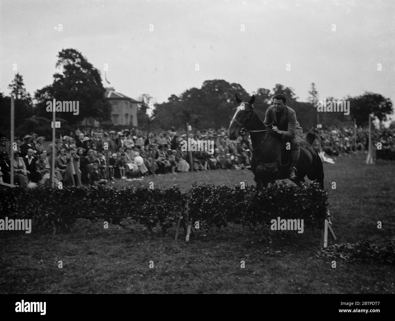 Horse jumping 1937 Stock Photo