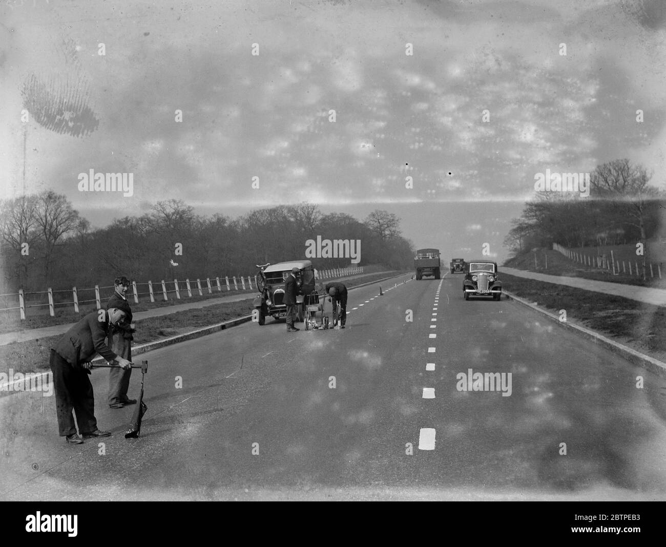 Painting white lines . 1935 Stock Photo Alamy