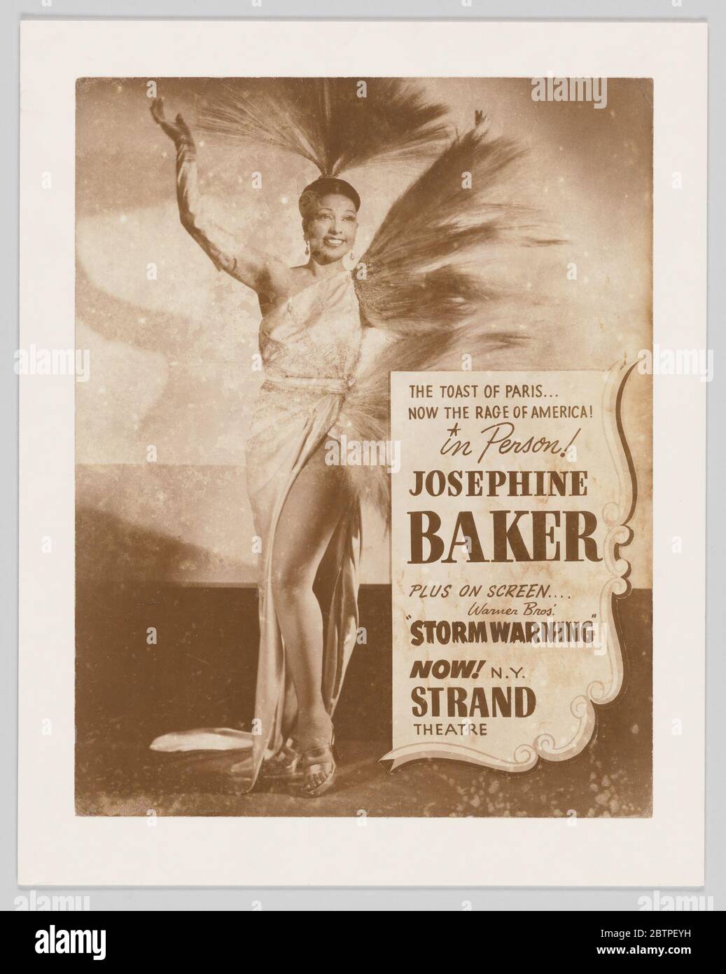 Poster of Josephine Baker advertising her performance at the Strand Theater. Poster of Josephine Baker advertising her performance at the Strand Theater. The poster features an image of Baker dressed in a long dress with feathers coming off the proper left side. Additional feathers sit atop her head in a faned out structure. Stock Photo