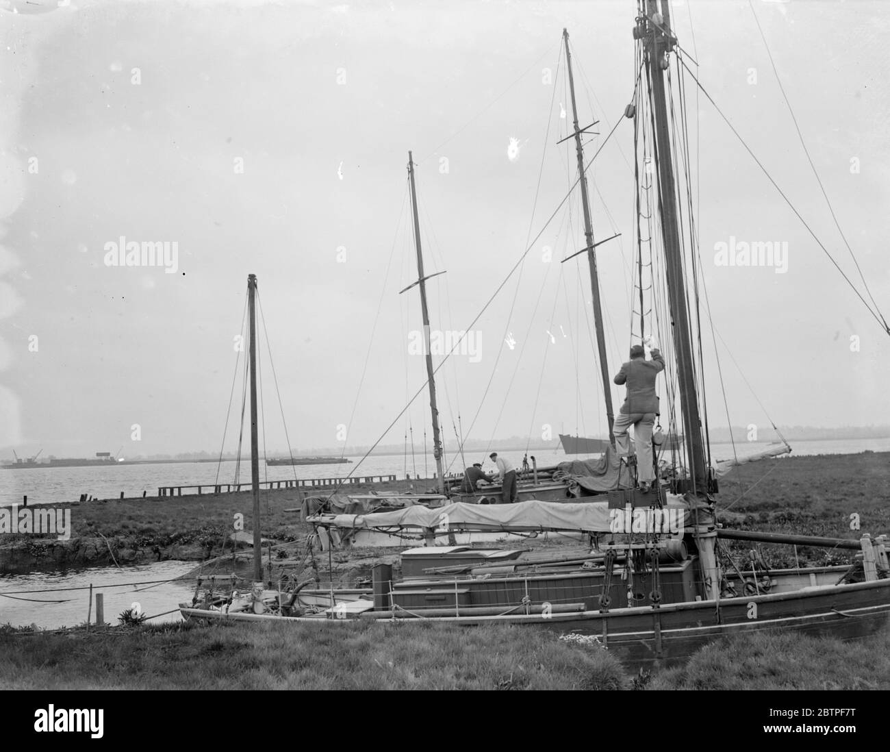 Erith yacht club . Sailors climb the rigging . 1936 Stock Photo Alamy