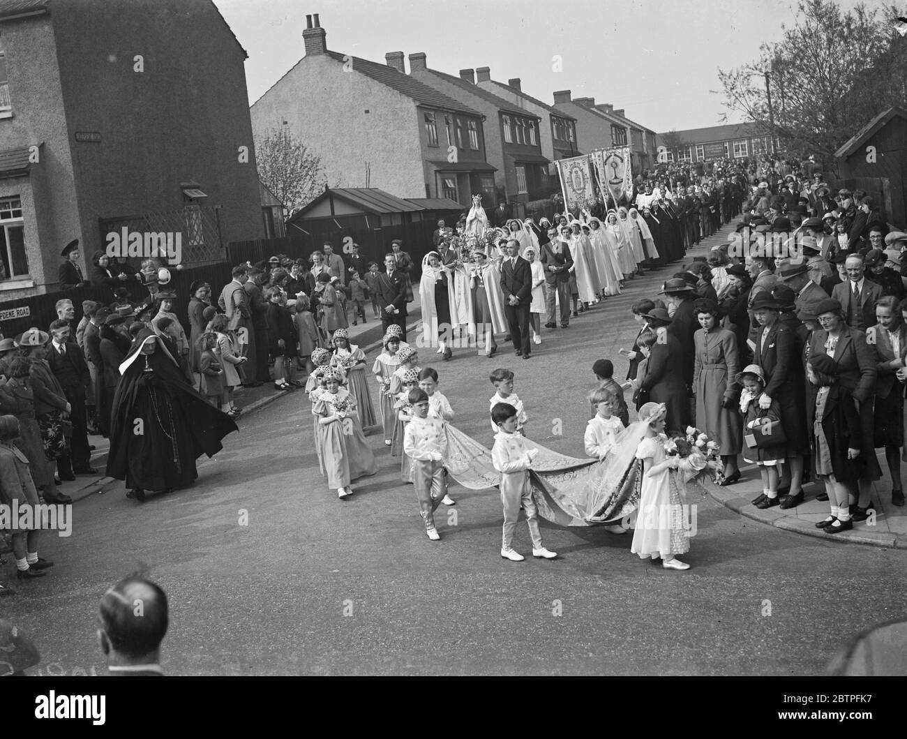 May Day festivities . The street procession of the May Day Queen after