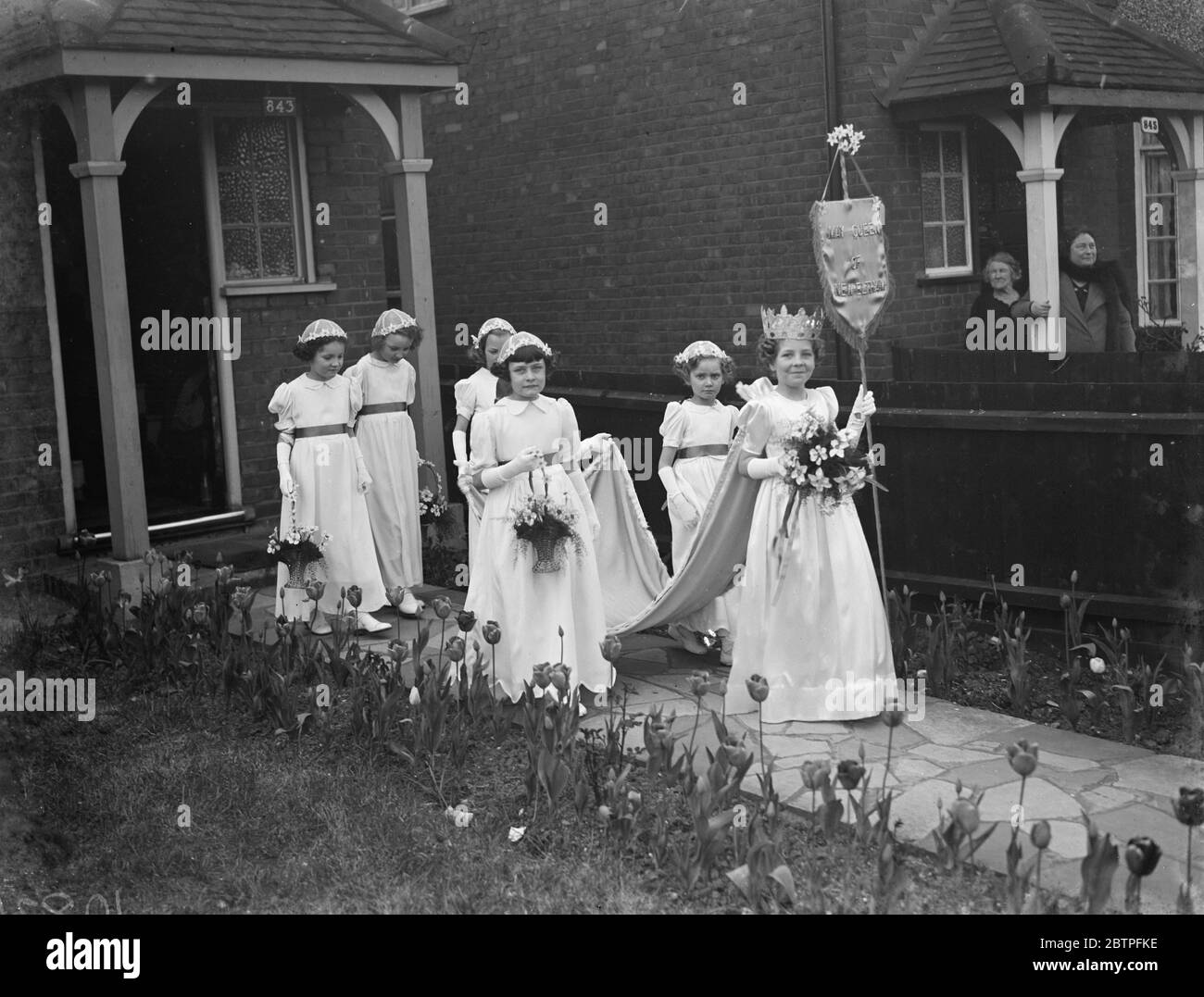 May Day festivities . Miss Peggy Sims the New Eltham May Queen leading her retinue . 6 May 1939 Stock Photo