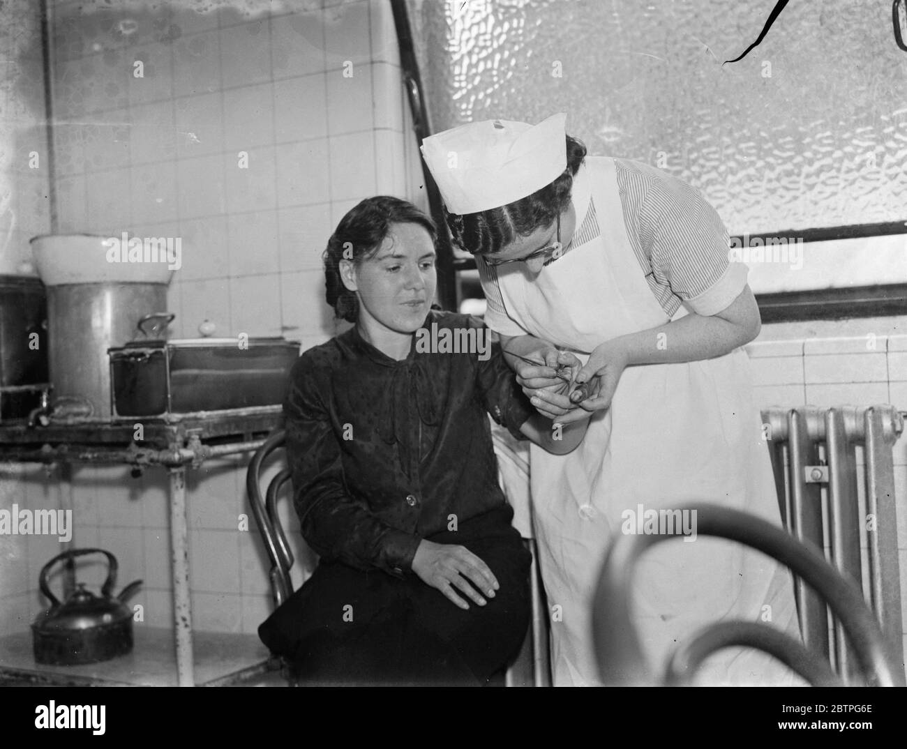 Gravesend hospital series . Nurse tending to a casualty . 1939 Stock Photo