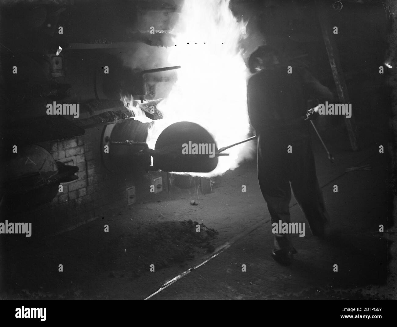 Gravesend Gasworks in Kent . Flames coming out of the retorts . 1939 Stock Photo