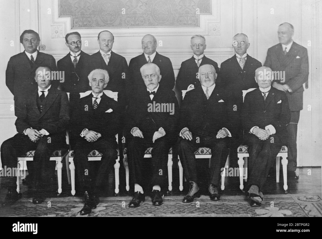 Belgian Cabinet . Sitting left to right : R Petitjean , P Hynans , J Renkin , F Coca , Houtart . Standing left to right : F Bovesst , Van Isacker , L Dens , Van Dievoet , H Heyman , P Crockaert . 8 June 1931 Stock Photo