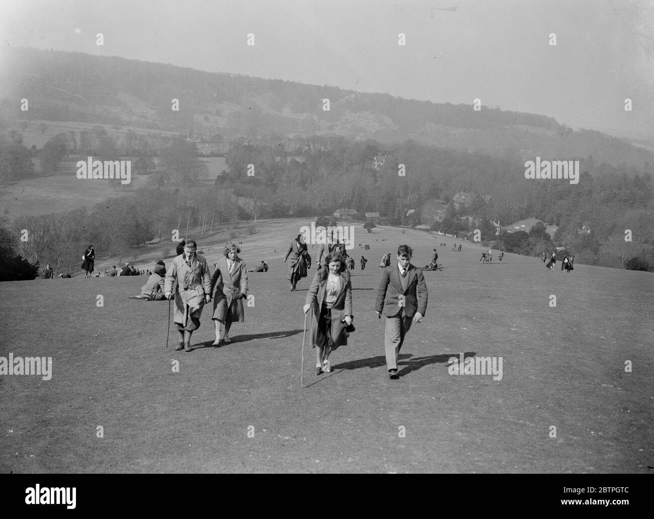 An open air Easter . Some of the many people who enjoyed an out of doors Good Friday hiking in Surrey , in the sunshine on Box Hill . 25 March 1932 Stock Photo
