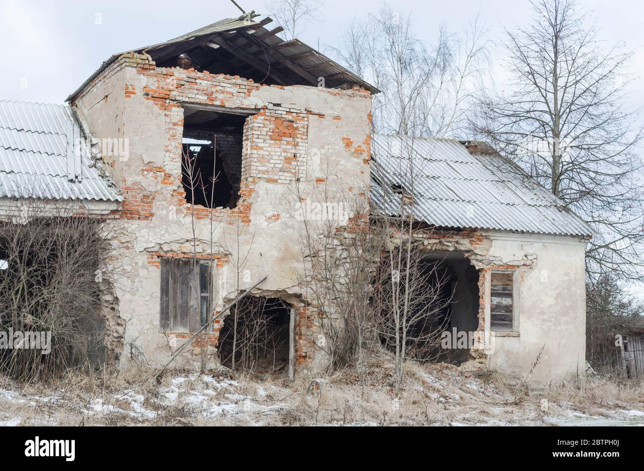 Abandoned residential building of old construction. Brickwork visible ...