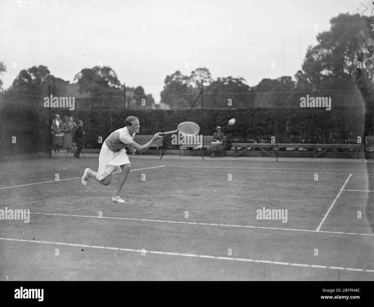 Fine action at Wimbledon . Miss B Batt in fine action in the Junior Tennis Championships at Wimbledon . 5 September 1932 Stock Photo