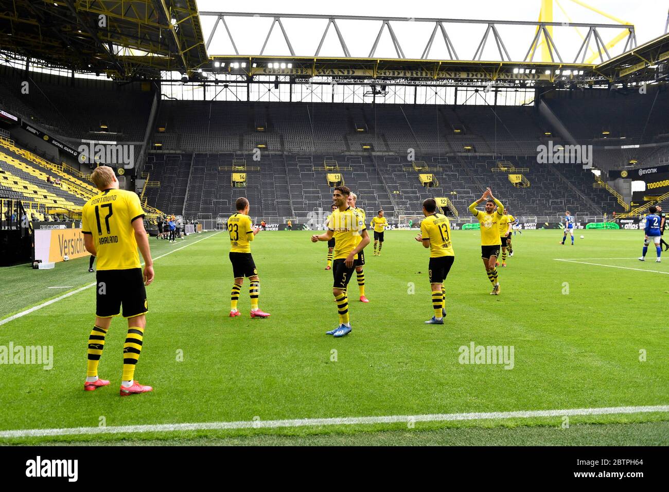 Dortmund's Erling Haaland, left, celebrates after scoring the opening goal during the German Bundesliga soccer match between Borussia Dortmund and Schalke 04 in Dortmund, Germany. Stock Photo