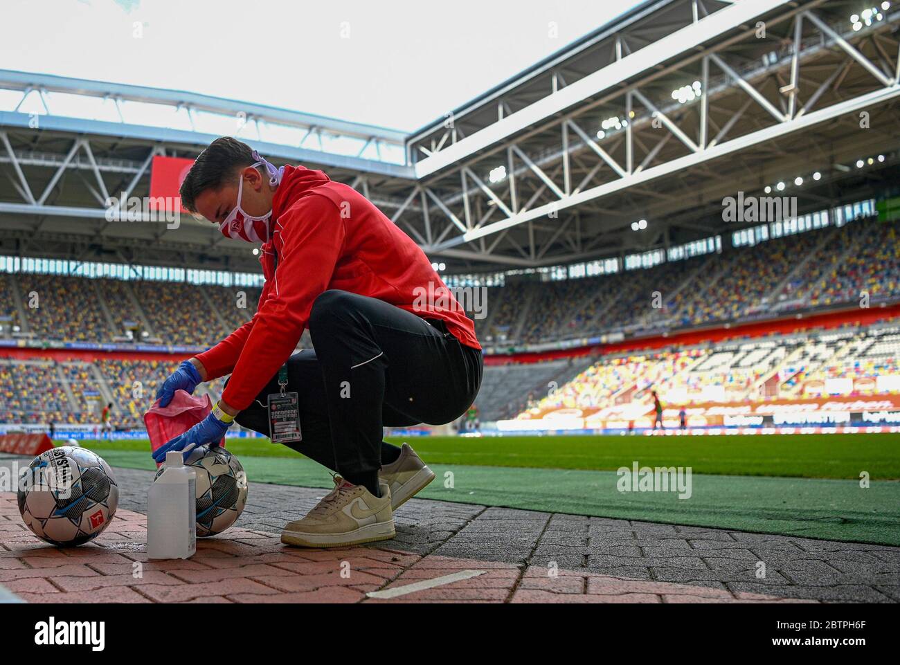 Footballs are disinfected during the Bundesliga soccer match between Duesseldorf and Paderborn in the Merkur Spiel-Arena, Duesseldorf, Germany, Saturday, May 16, 2020. The German Bundesliga becomes the world's first major soccer league to resume after a two-month suspension because of the coronavirus pandemic. Stock Photo