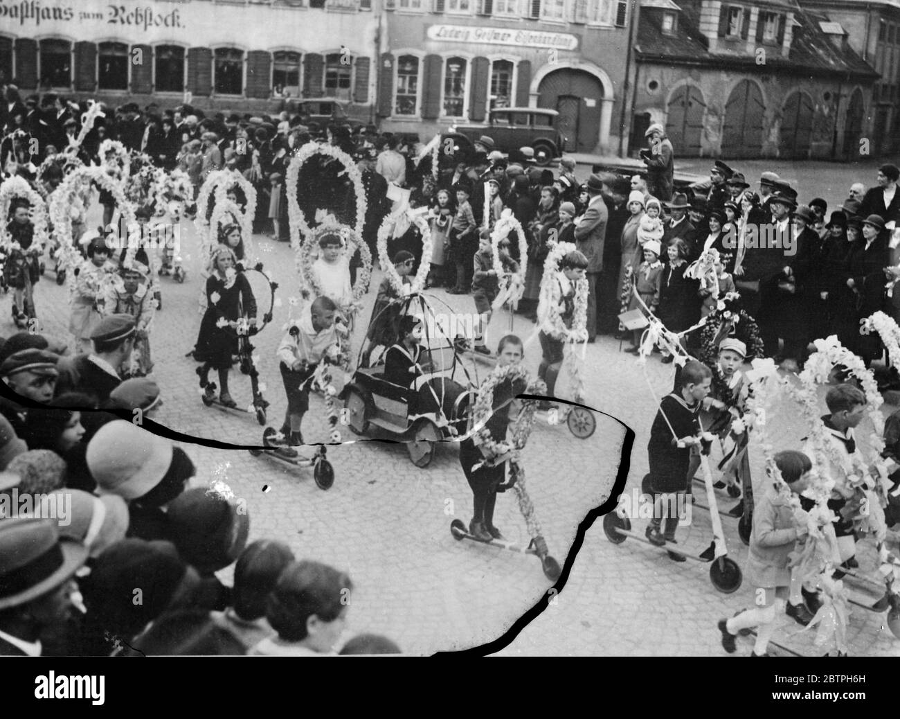 Historic festival welcomes summer . The traditional summer festival which marks the end of the cold winter and beginning of summer took place at Bruchsal in Southern Germany , when children of the town paraded in pageant array through the streets . The parade of children through the streets of Bruchsal , to welcome summer . 29 April 1932 Stock Photo