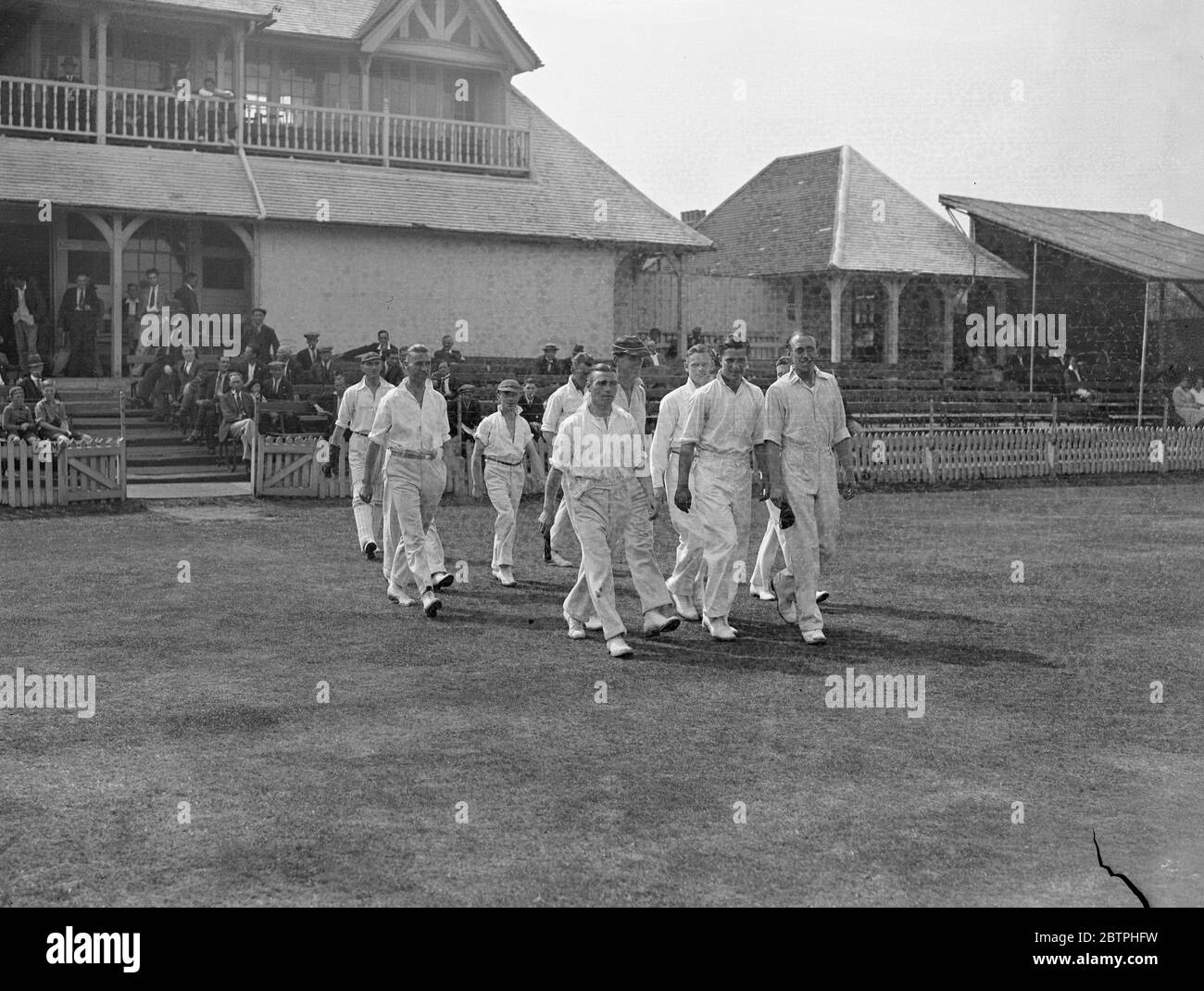 Footballers at cricket . West Ham met Clapton Orient in a cricket match at the Essex County Cricket Ground at Leyton . The Clapton Orient team going out to field . 17 August 1932 Stock Photo